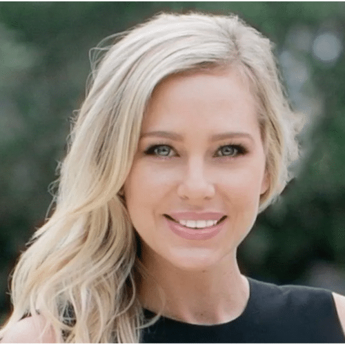 A female real estate agent's smiling headshot